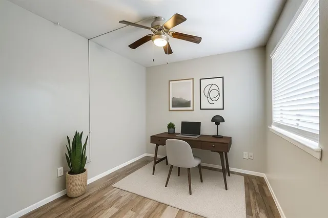 a view of a dining room with furniture and wooden floor