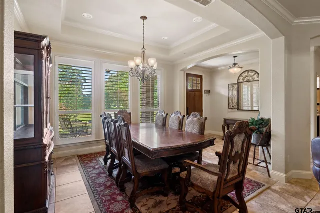 a view of a dining room with furniture window and outside view