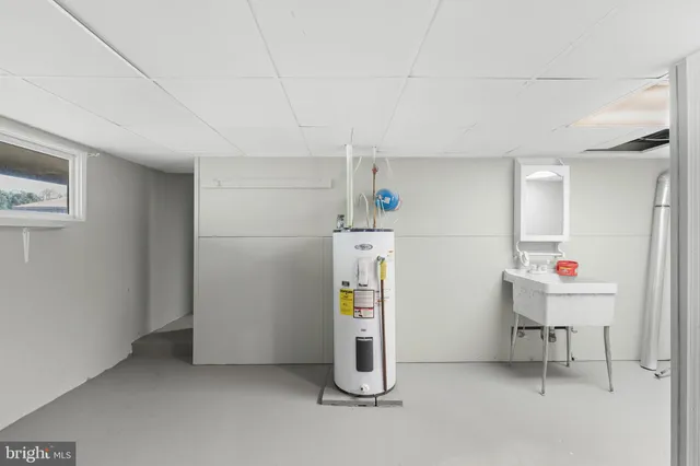 a view of a room with wooden floor and white walls