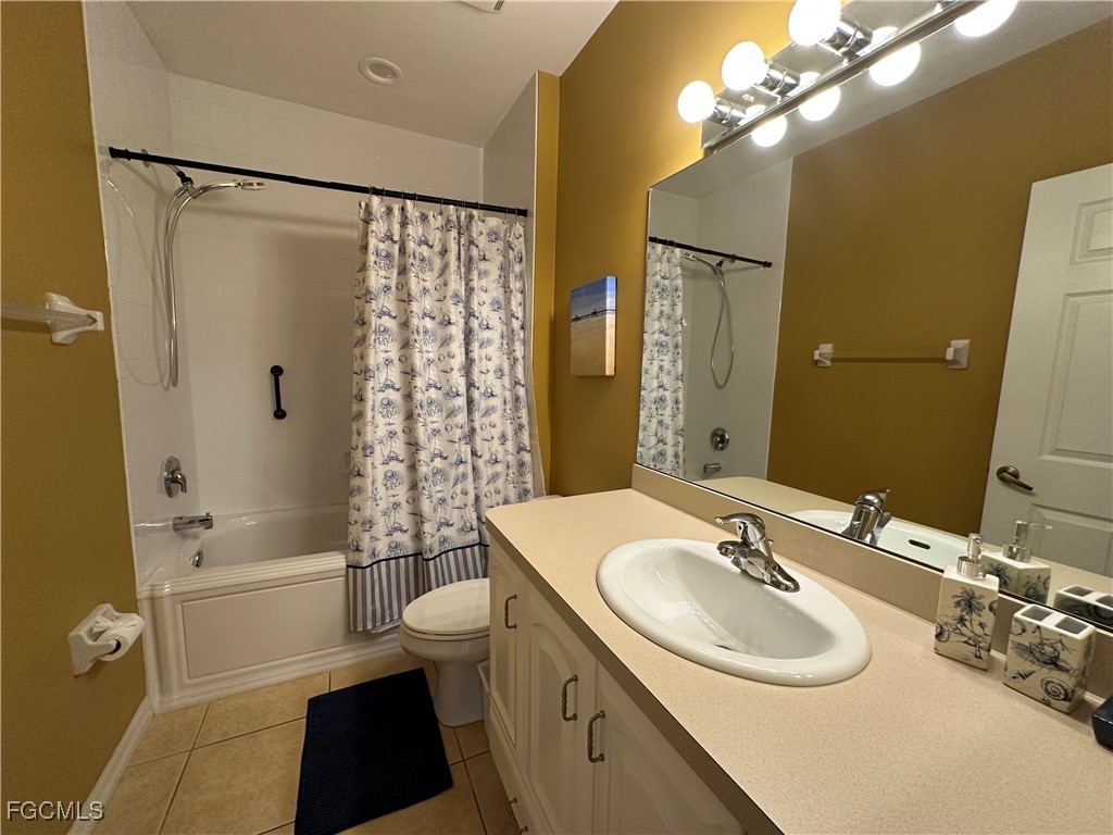 2280 Somerset Ridge Drive, Unit 204 Lehigh Acres, FL 33973 - Photo 17 of 41 a bathroom with a sink a toilet and shower a mirror
