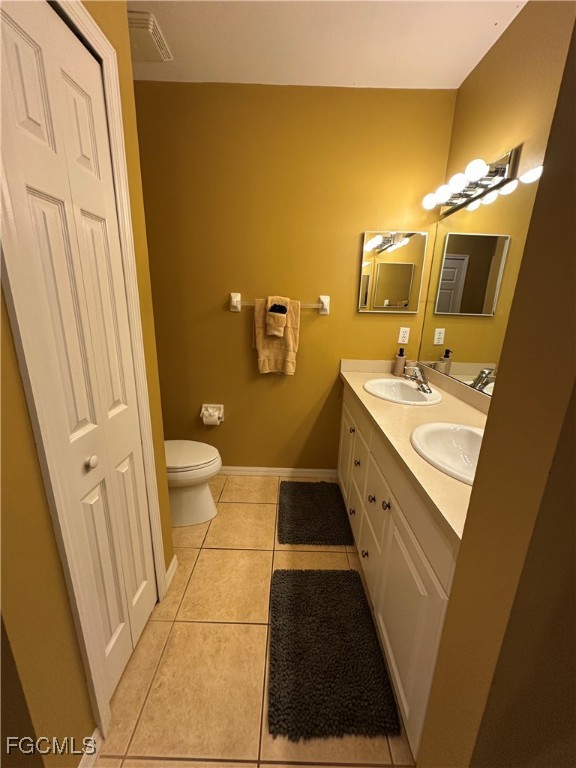 2280 Somerset Ridge Drive, Unit 204 Lehigh Acres, FL 33973 - Photo 30 of 41 a bathroom with a sink a toilet a mirror and shower