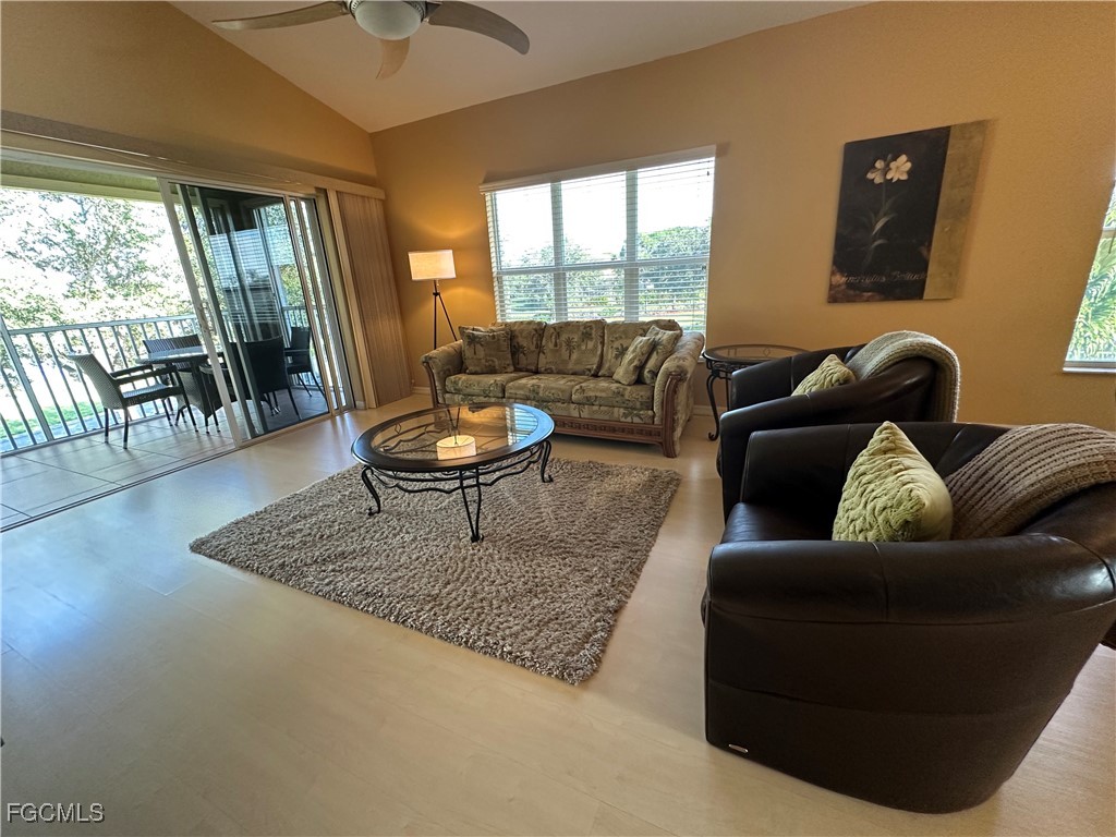 2280 Somerset Ridge Drive, Unit 204 Lehigh Acres, FL 33973 - Photo 33 of 41 a living room with furniture and a rug