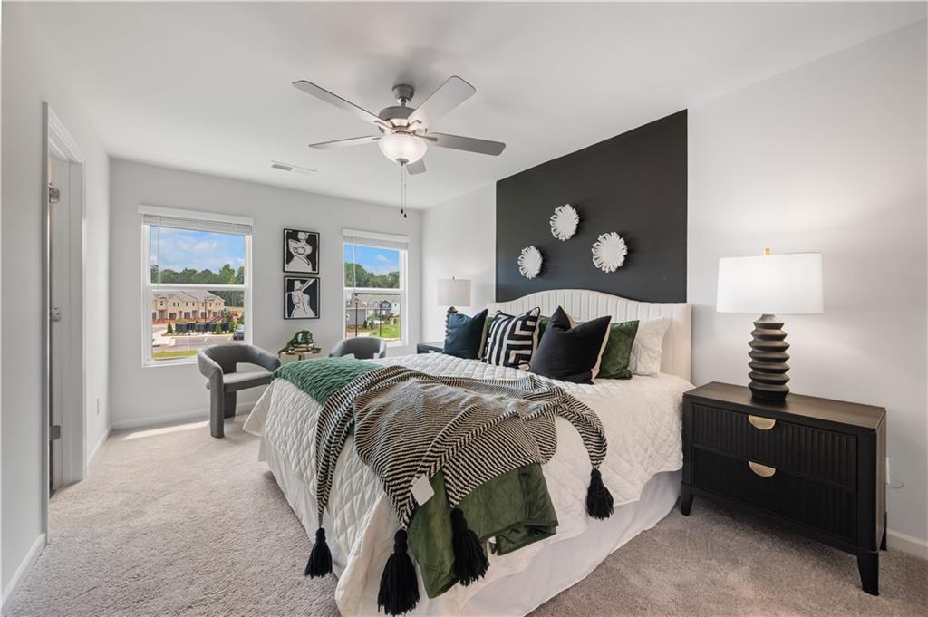 9437 Maple Grove Lane Jonesboro, GA 30238 - Photo 23 of 32 a bed room with a bed and a lamp