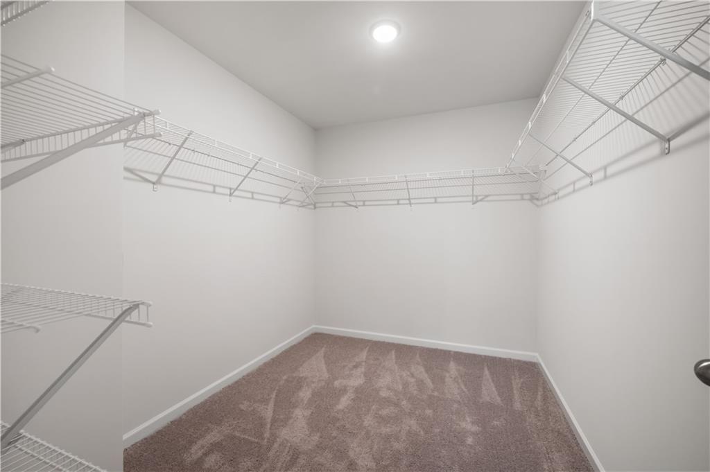 9437 Maple Grove Lane Jonesboro, GA 30238 - Photo 28 of 32 a view of a room with racks on the wall