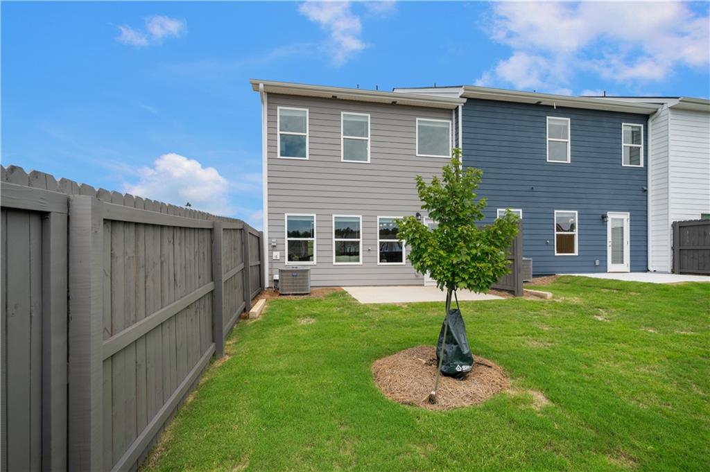 9437 Maple Grove Lane Jonesboro, GA 30238 - Photo 32 of 32 a front view of a house with a yard