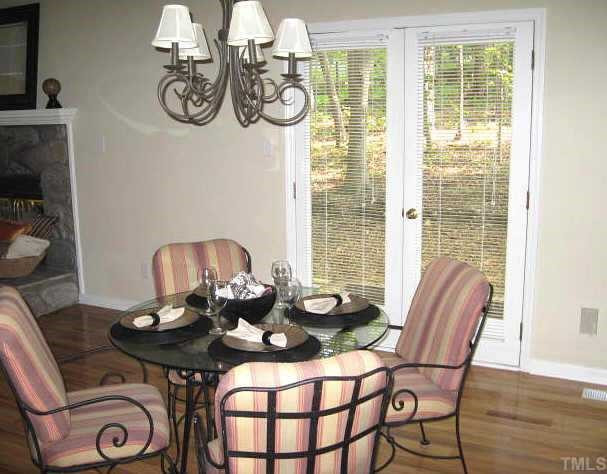 611 Brent Road Raleigh, NC 27606 - Photo 3 of 10 Bright dining area with lovely fixture, new hardwoods, & french doors leading to patio Other
