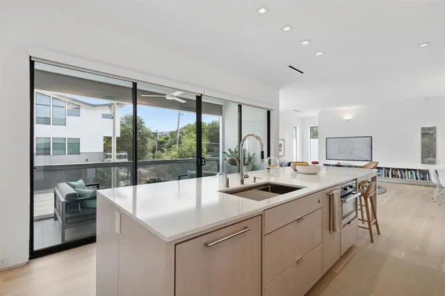 a kitchen with a sink and stove