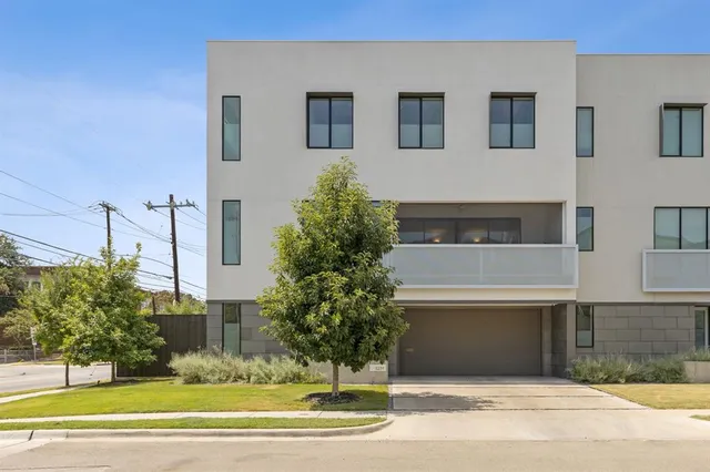 a view of a building with a yard