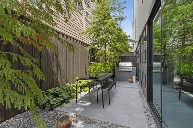 a view of a chairs and table in the patio