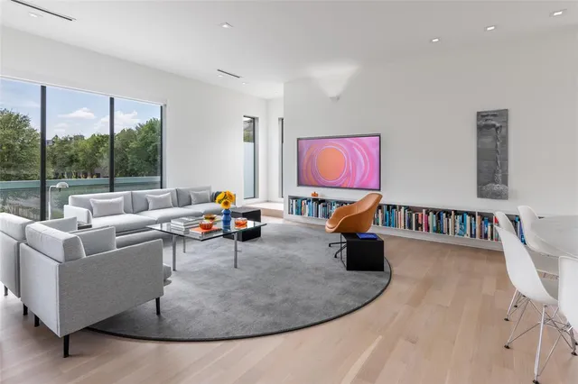 a living room with furniture and a lamp