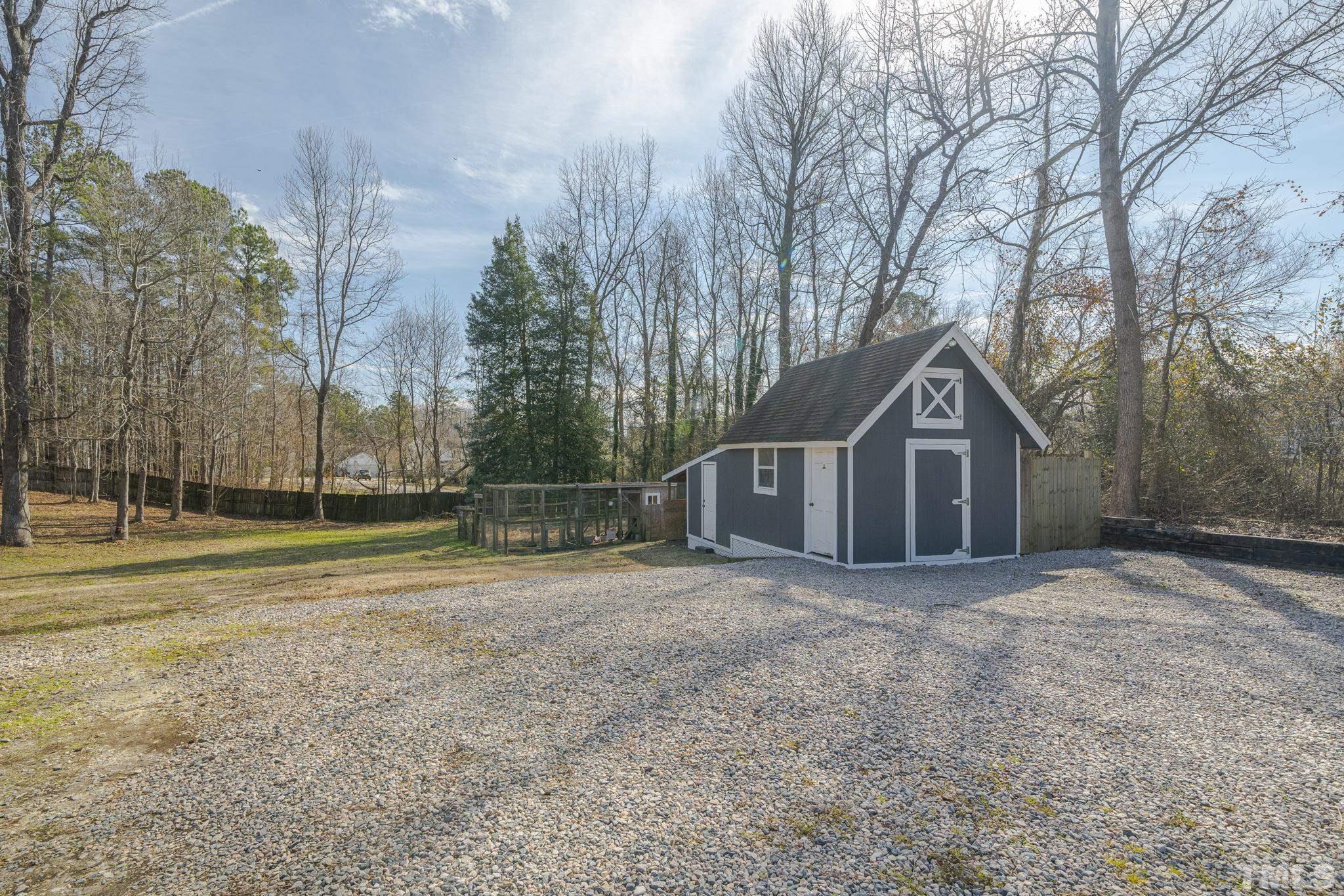 3500 Cartway Lane Raleigh, NC 27616 - Photo 28 of 35 a front view of a house with a yard and trees