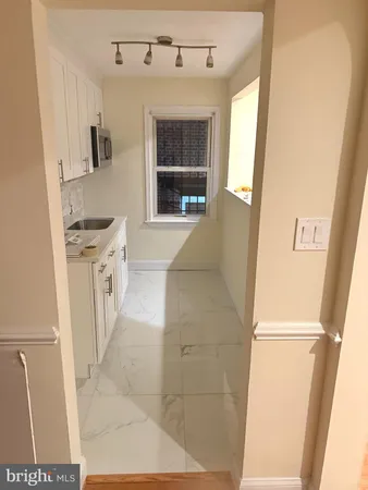 a bathroom with a sink a mirror and a shower