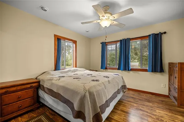 a bedroom with a large bed and a window