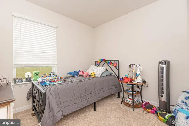 a bedroom with furniture and a bed