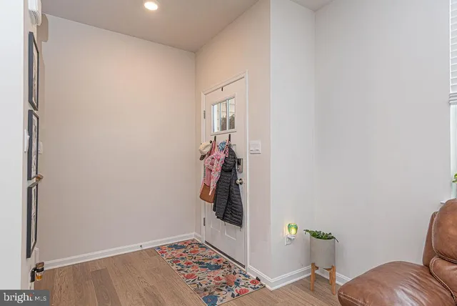 a view of hallway with livingroom and furniture