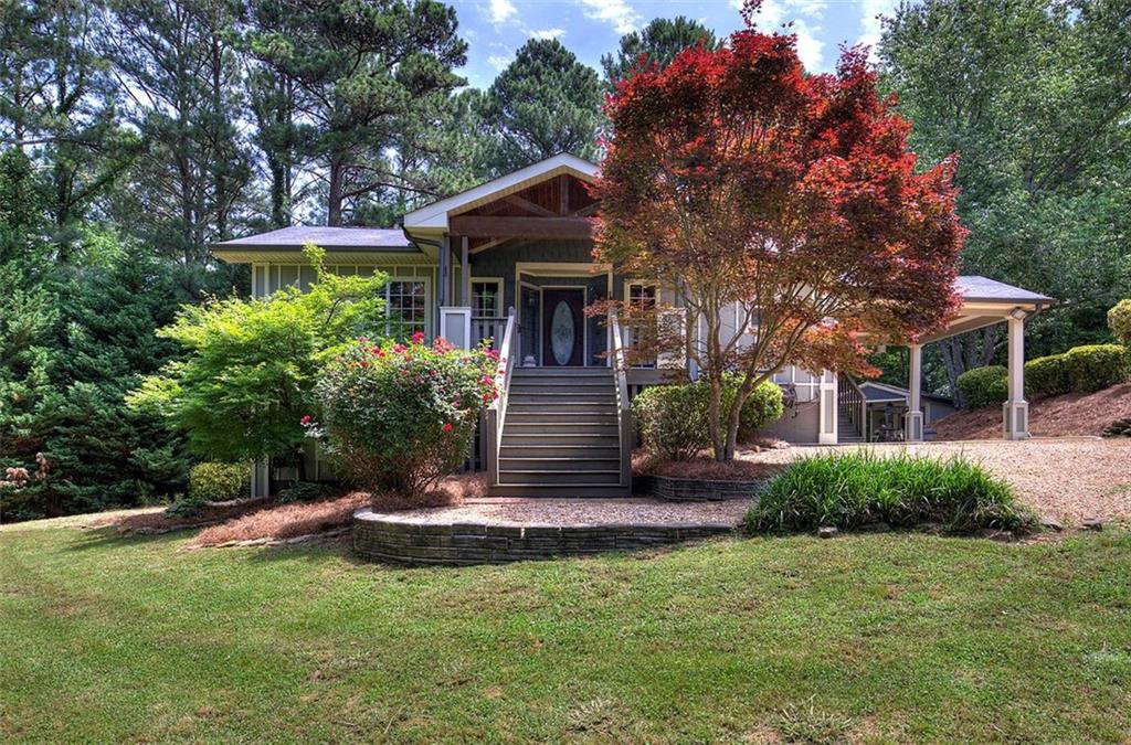 a front view of a house with garden