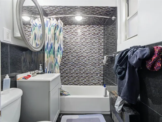 a bathroom with a bathtub sink and toilet