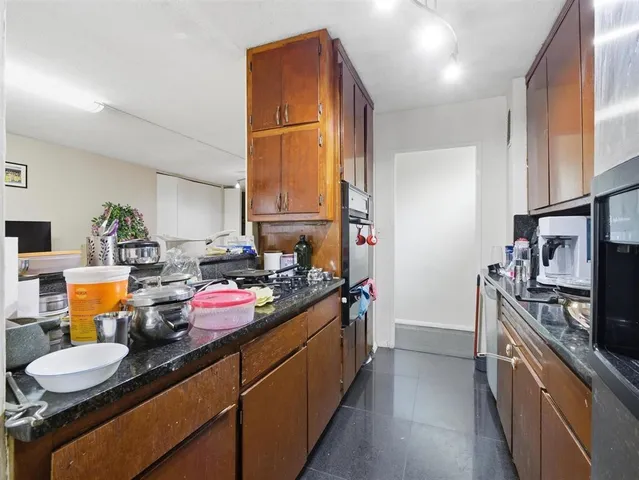 a kitchen with a sink stove and refrigerator