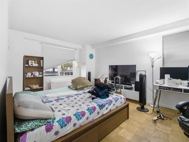 a bedroom with a bed and furniture