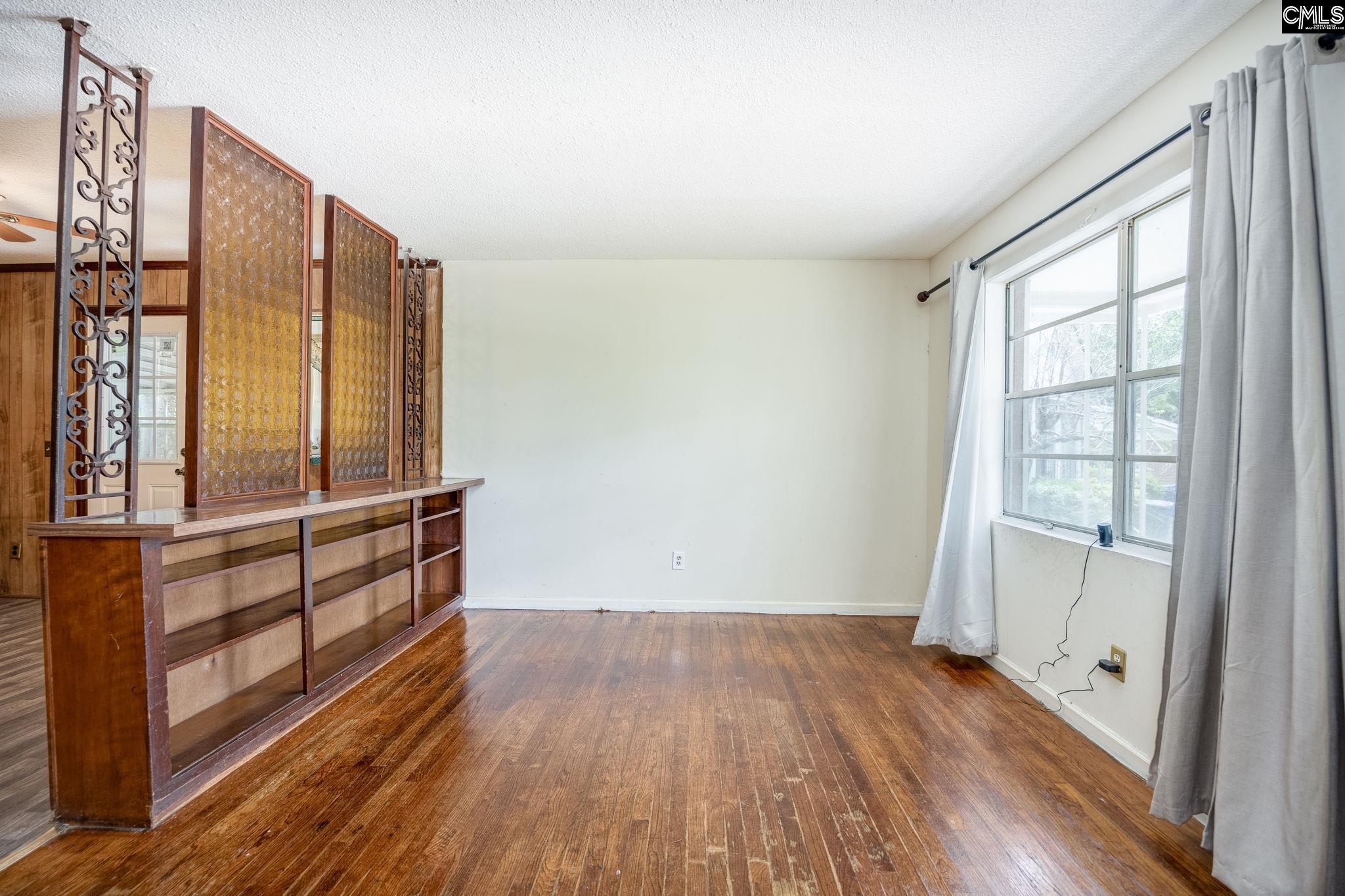 5666 Middleton Court Columbia, SC 29203 - Photo 11 of 42 an empty room with wooden floor and windows