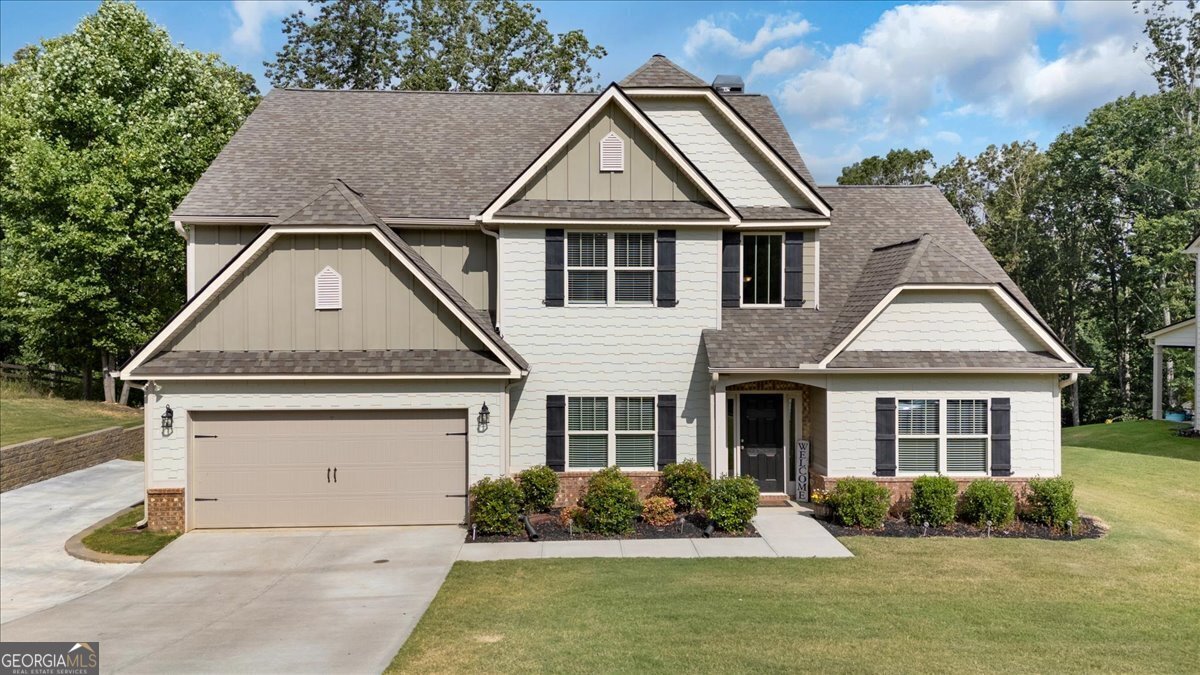 a front view of a house with a yard