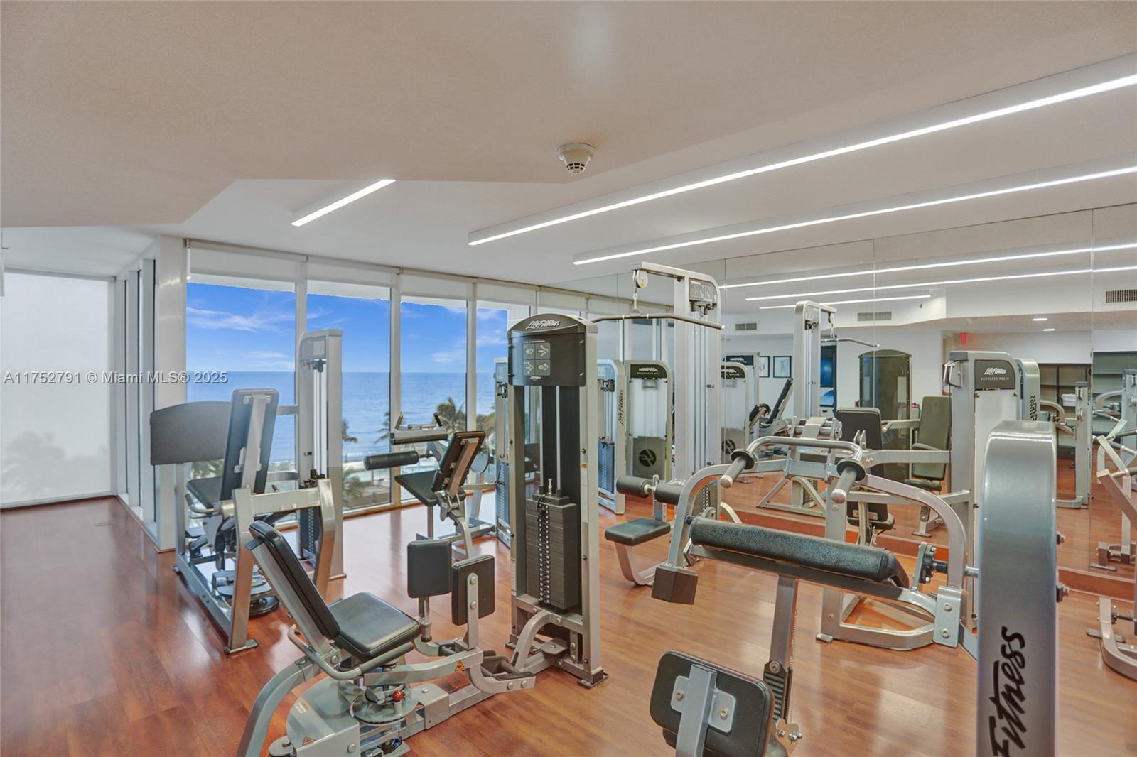 19111 Collins Avenue, Unit PH4 Sunny Isles Beach, FL 33160 - Photo 17 of 73 a view of a room with gym equipment