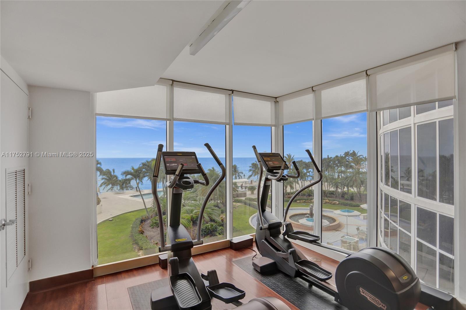 19111 Collins Avenue, Unit PH4 Sunny Isles Beach, FL 33160 - Photo 18 of 73 a view of a room with gym equipment