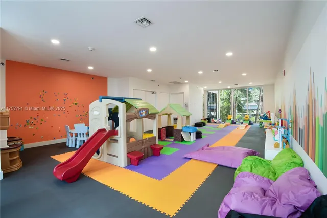 a view of an empty room with glass door
