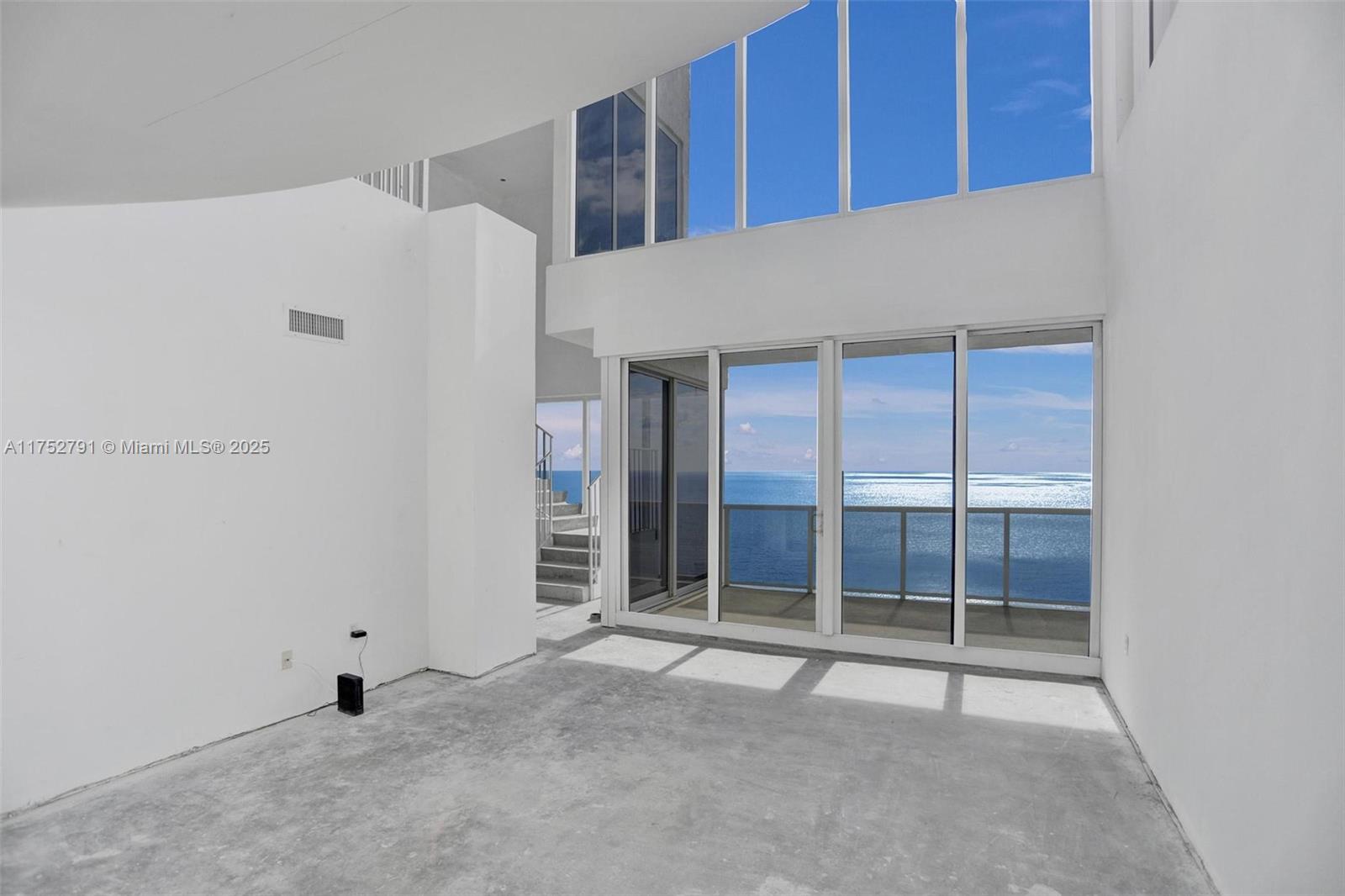 19111 Collins Avenue, Unit PH4 Sunny Isles Beach, FL 33160 - Photo 31 of 73 a view of an empty room with a window