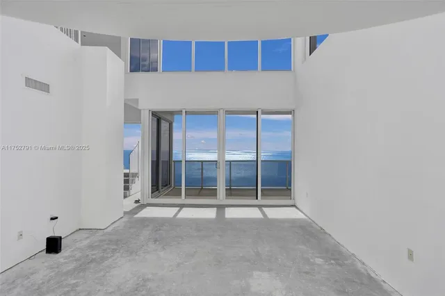 a view of a balcony with an ocean view