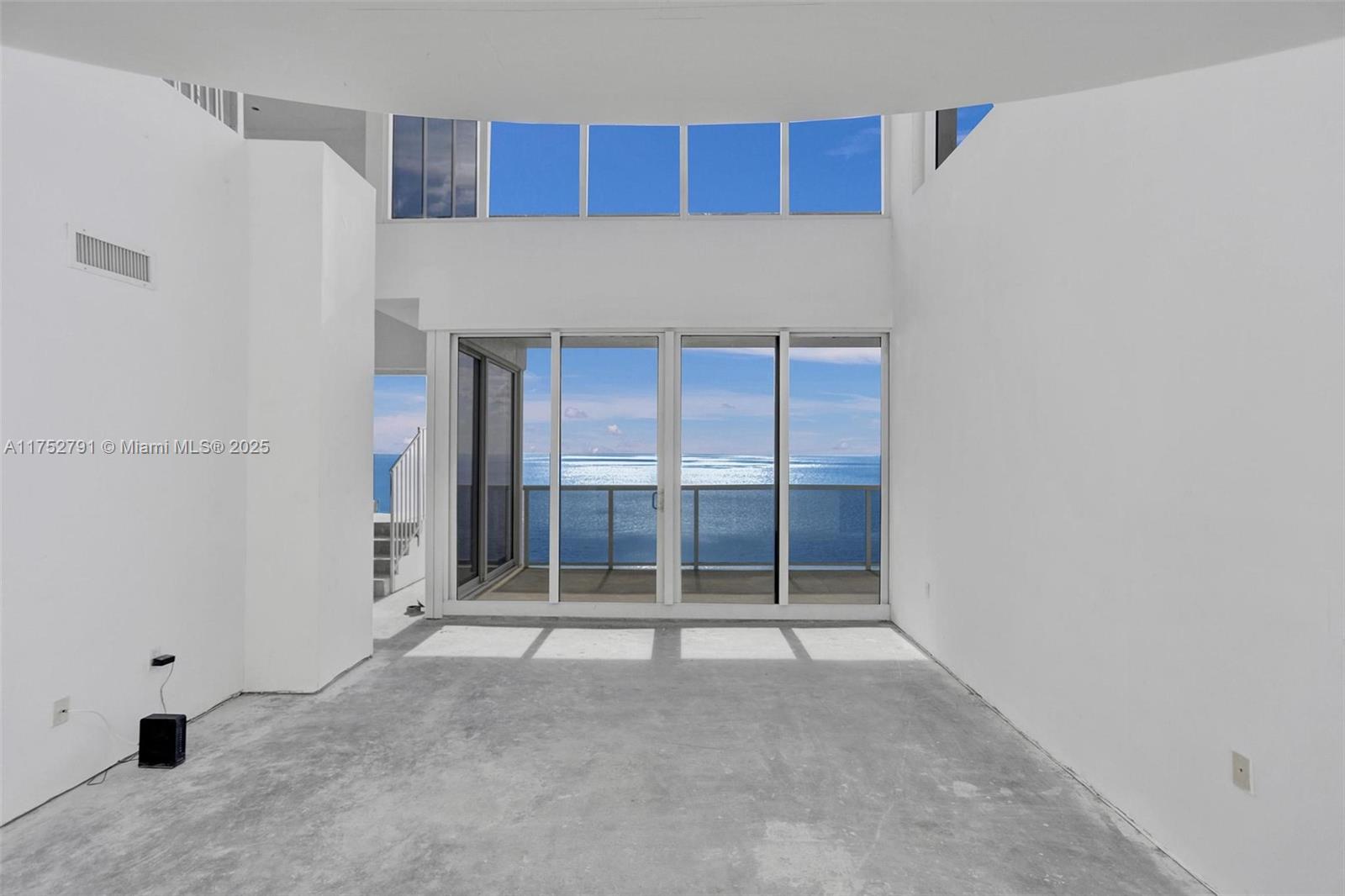 19111 Collins Avenue, Unit PH4 Sunny Isles Beach, FL 33160 - Photo 32 of 73 a view of an empty room with a window