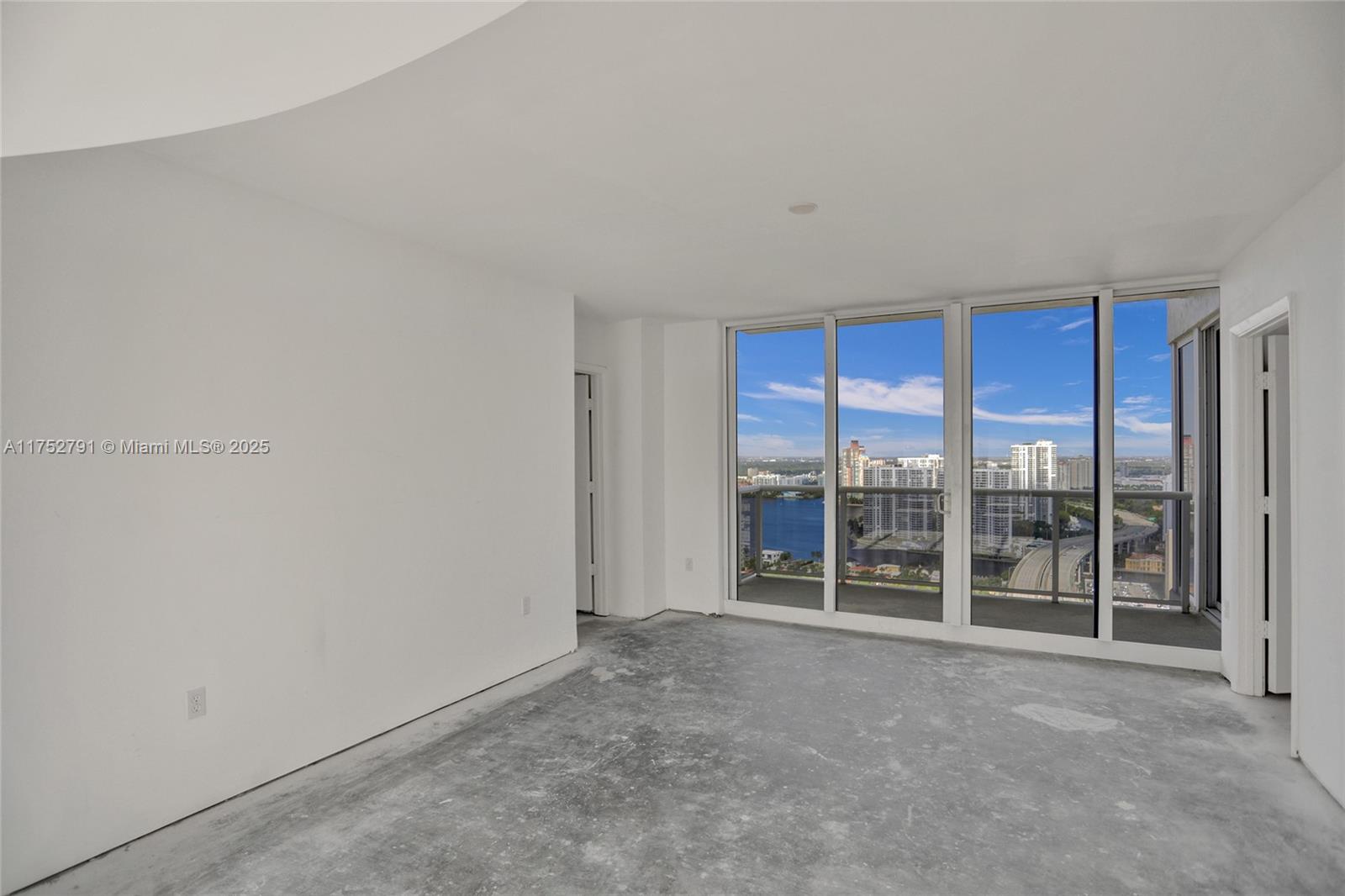 19111 Collins Avenue, Unit PH4 Sunny Isles Beach, FL 33160 - Photo 37 of 73 a view of an empty room with glass door
