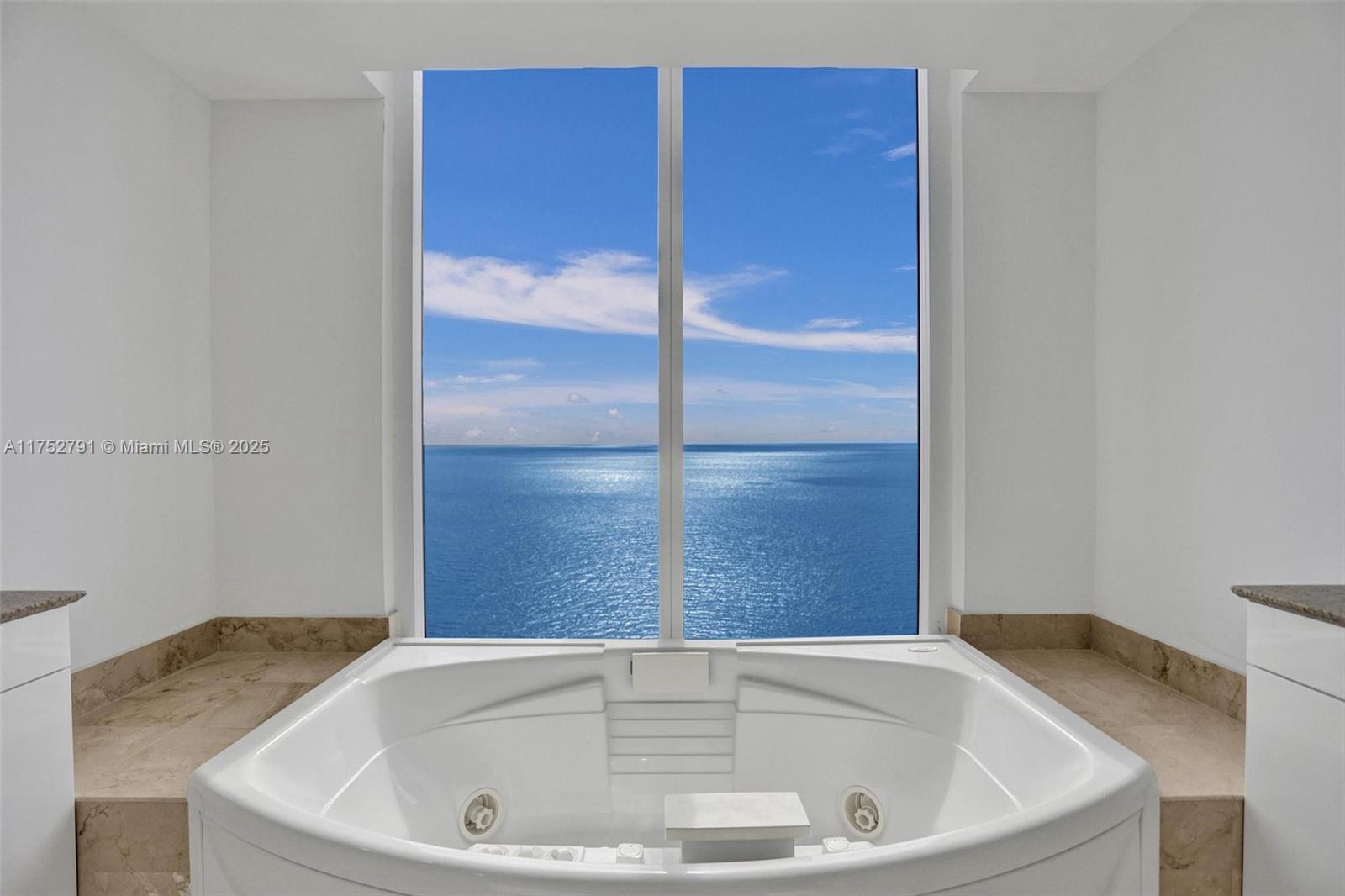 19111 Collins Avenue, Unit PH4 Sunny Isles Beach, FL 33160 - Photo 41 of 73 a bathroom with a tub