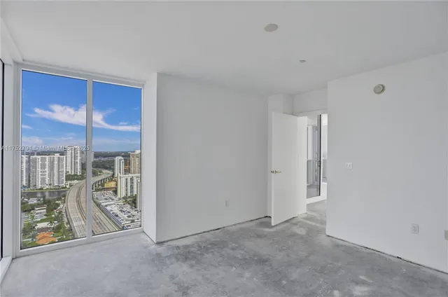 a view of a city with lawn chairs