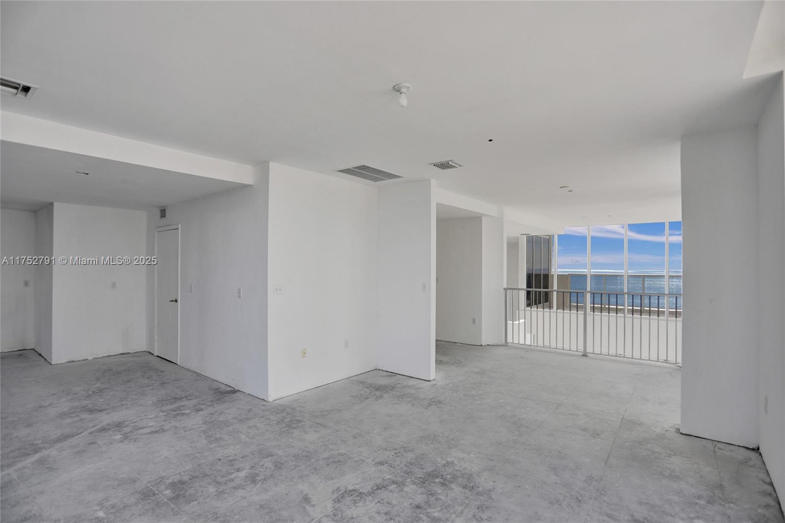 19111 Collins Avenue, Unit PH4 Sunny Isles Beach, FL 33160 - Photo 52 of 73 a view of an empty room with a window