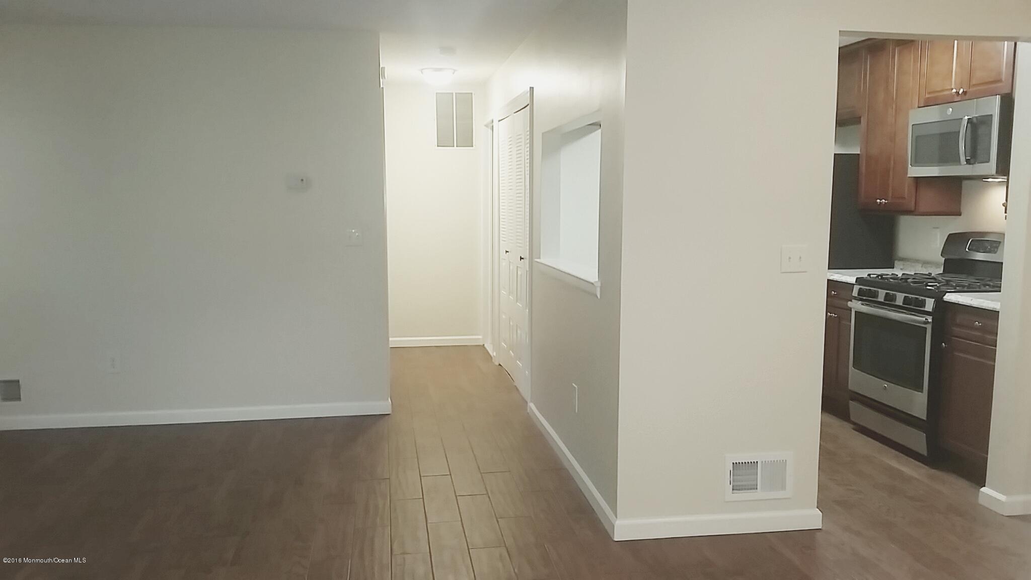 71 Azalea Circle Jackson, NJ 08527 - Photo 11 of 23 a view of a kitchen from the hallway