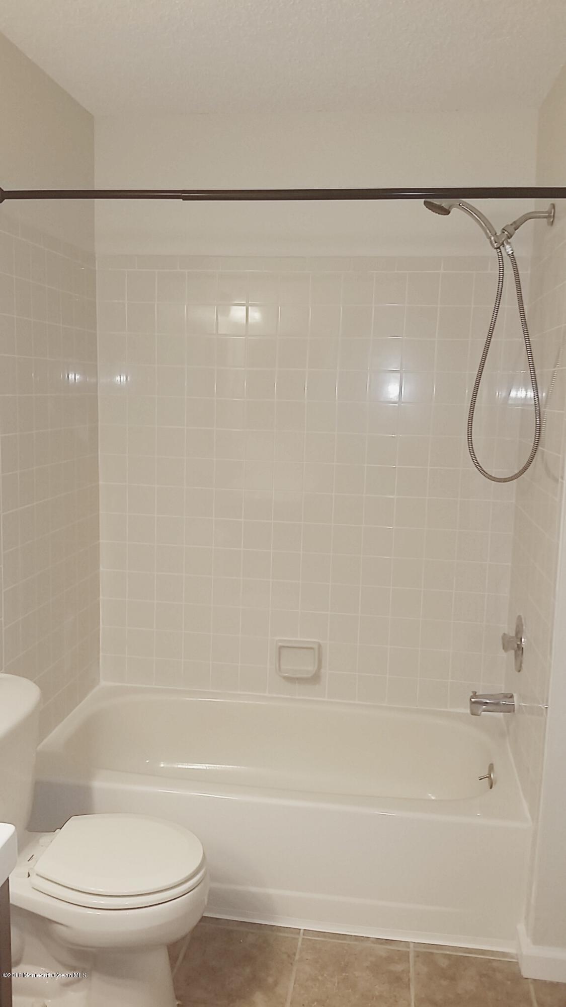 71 Azalea Circle Jackson, NJ 08527 - Photo 20 of 23 a bathroom with a shower and a toilet