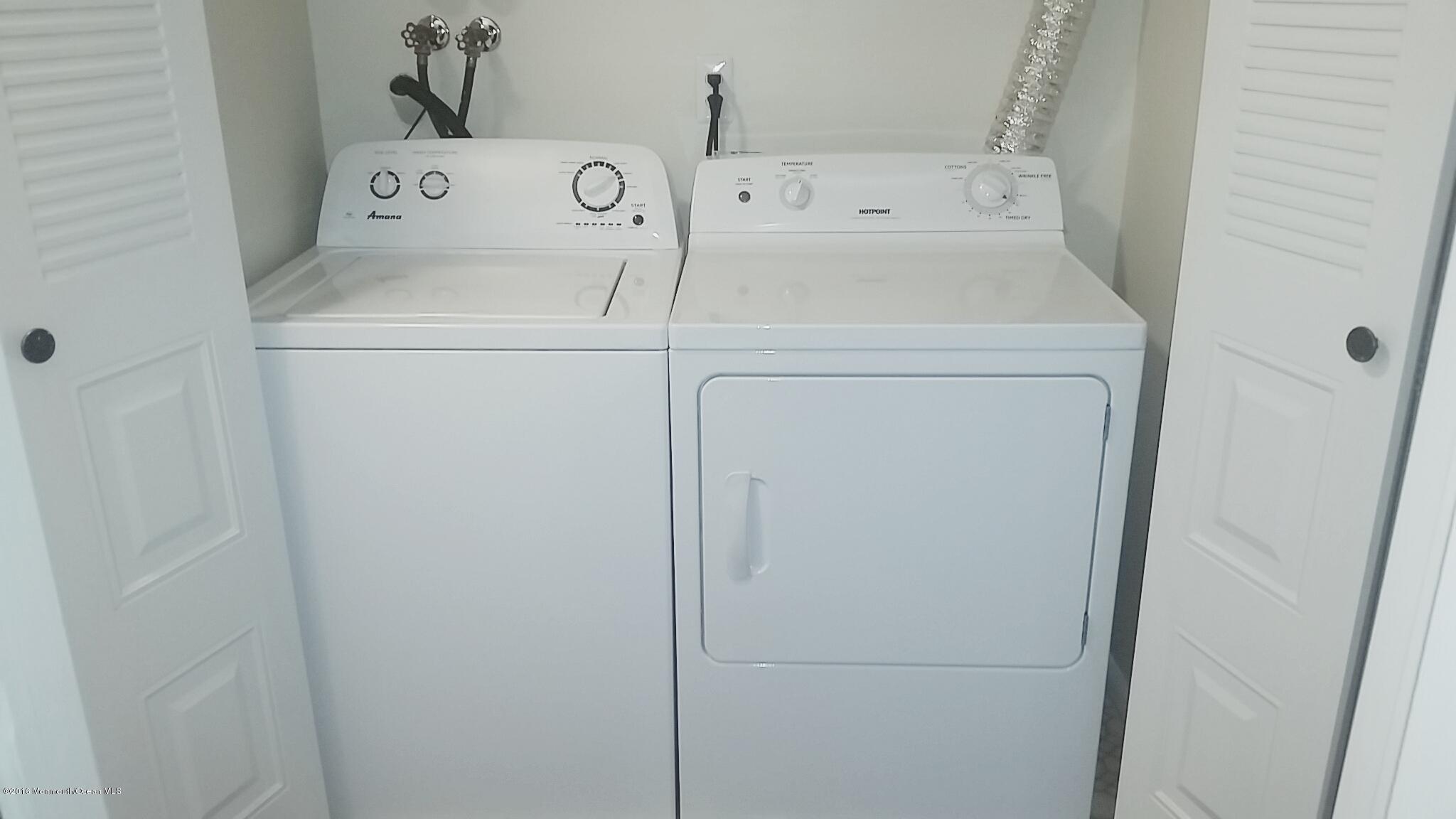 71 Azalea Circle Jackson, NJ 08527 - Photo 22 of 23 a utility room with dryer and washer