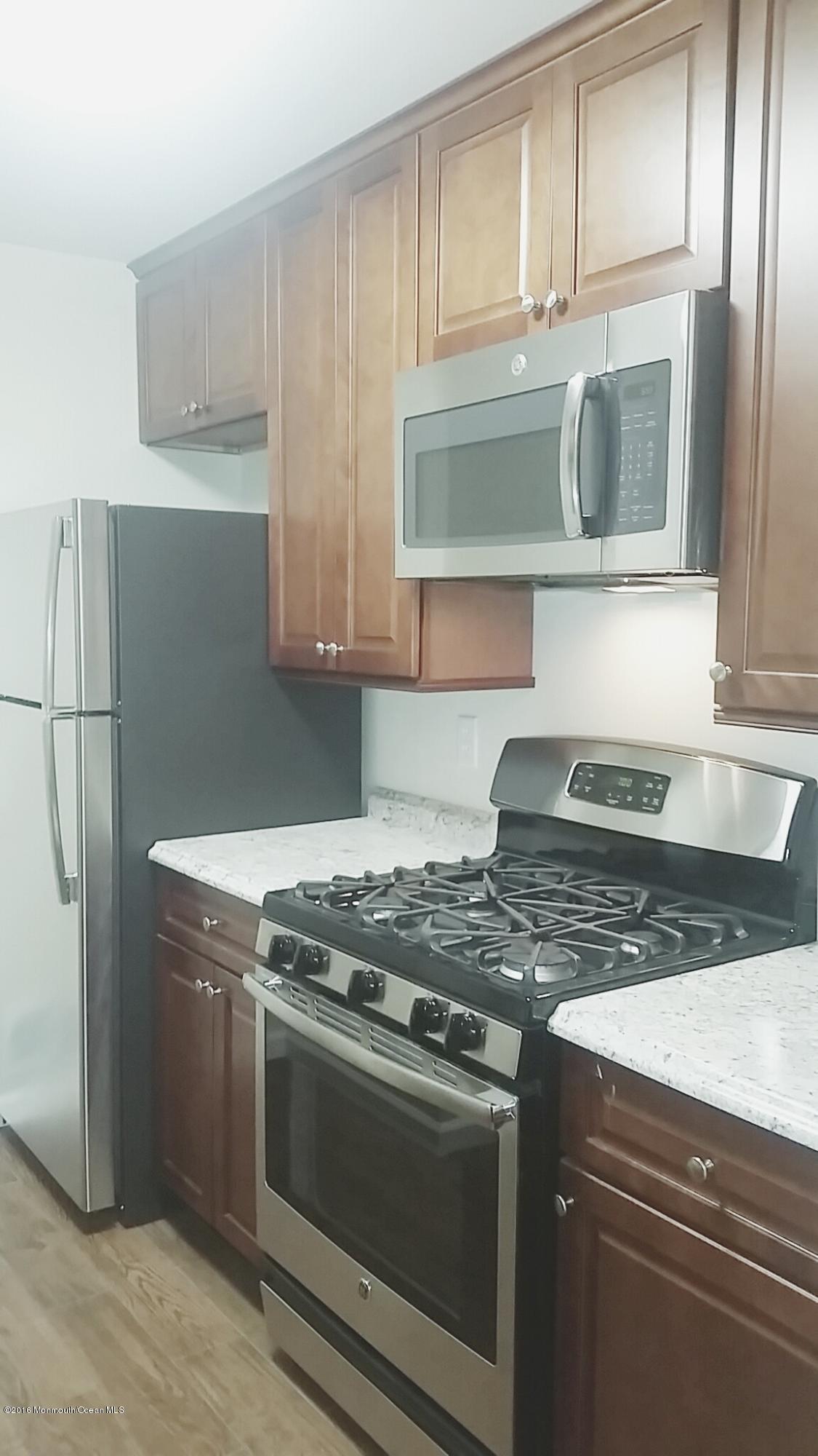 71 Azalea Circle Jackson, NJ 08527 - Photo 6 of 23 a stove top oven sitting inside of a kitchen
