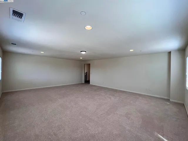 a bathroom with a double vanity sink toilet and a mirror