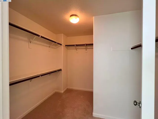 a spacious bathroom with a double vanity sink and a mirror