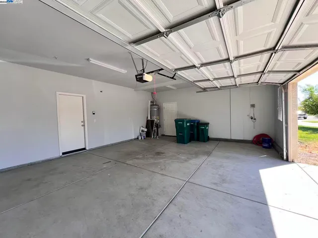 front view of a house with potted plants