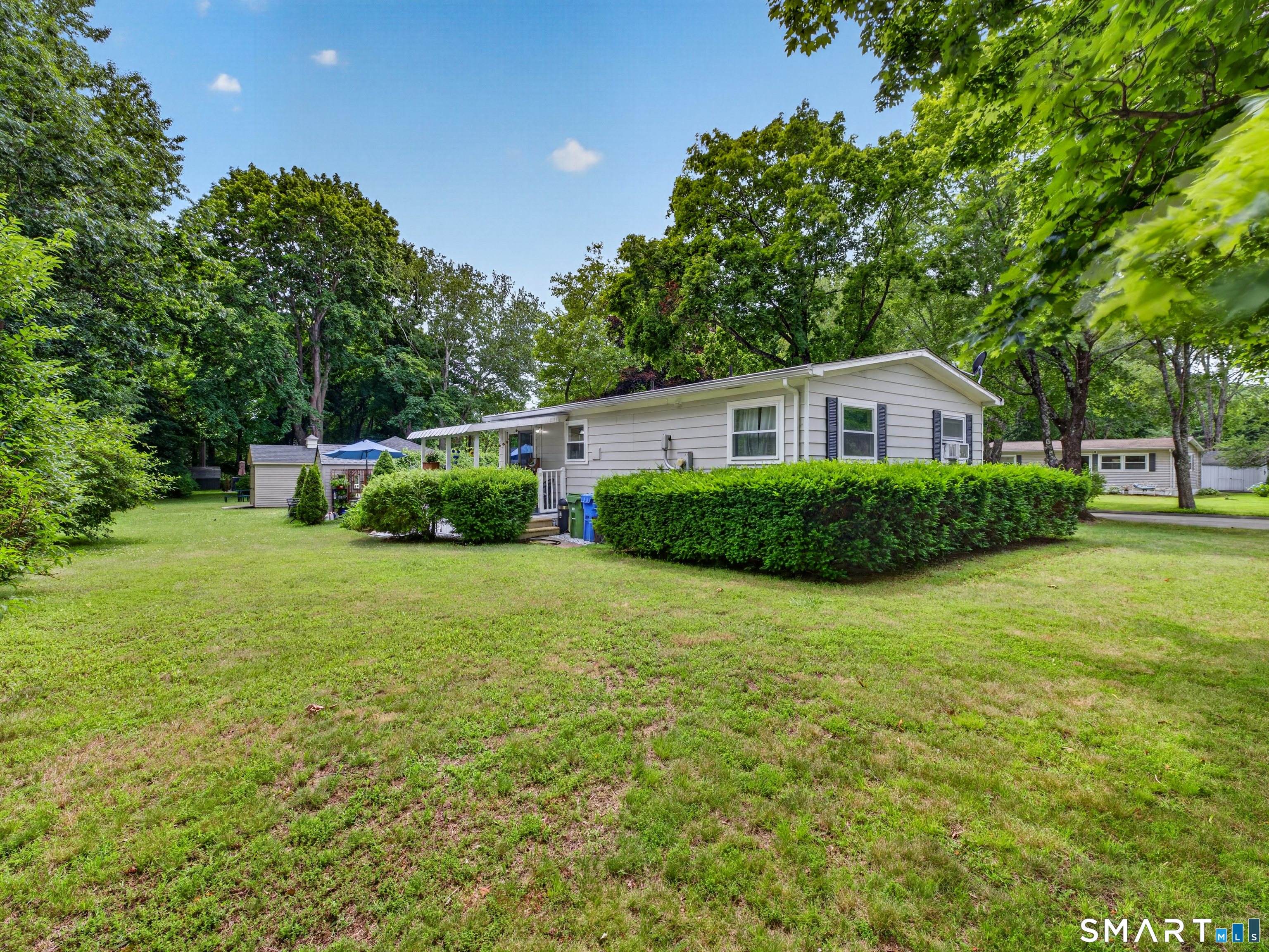 18 Old Forge Road Westbrook, CT 06498 - Photo 4 of 28 a house with a tree in front of it