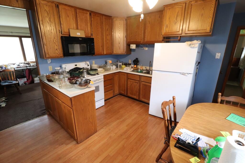 629 Superior Street Michigan City, IN 46360 - Photo 13 of 35 a kitchen with a sink appliances and cabinets