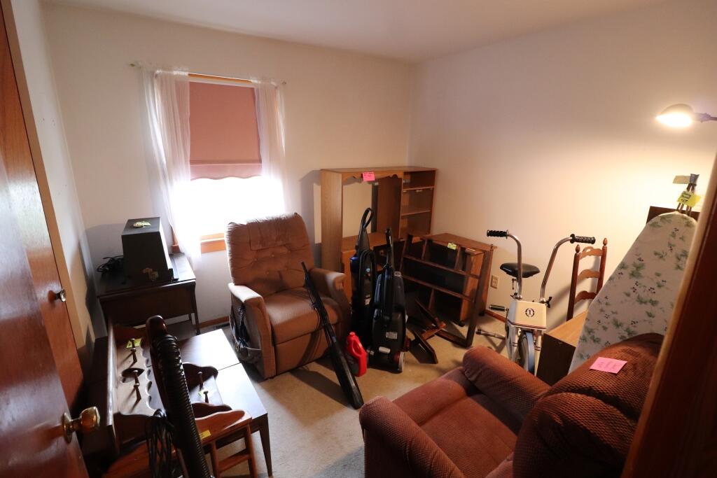 629 Superior Street Michigan City, IN 46360 - Photo 16 of 35 a living room with furniture a flat screen tv and a window
