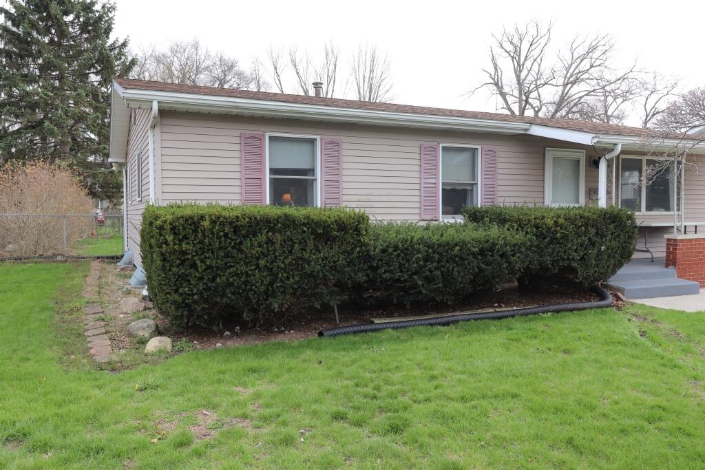 629 Superior Street Michigan City, IN 46360 - Photo 4 of 35 a view of a house with a yard plants and large tree