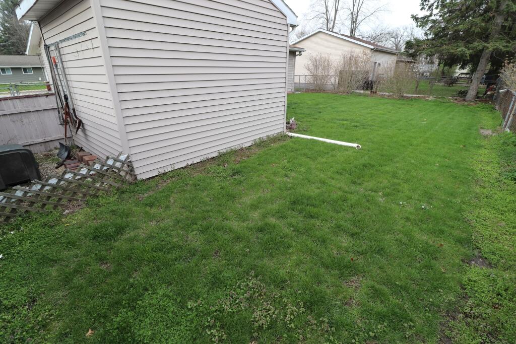 629 Superior Street Michigan City, IN 46360 - Photo 8 of 35 a view of a backyard with a garden