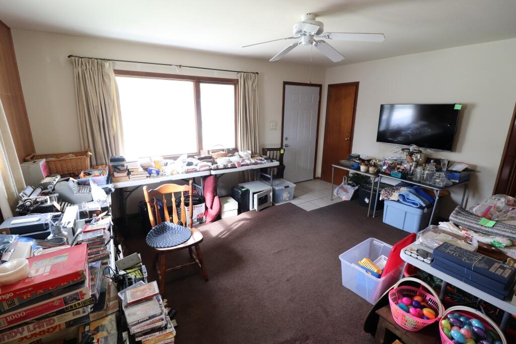 629 Superior Street Michigan City, IN 46360 - Photo 10 of 35 a living room with furniture a flat screen tv and a large window