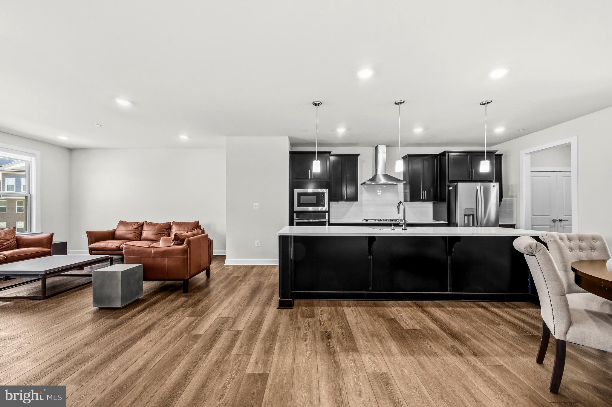 103 Brown Branch Road Laurel, MD 20708 - Photo 12 of 35 a living room with furniture and kitchen view