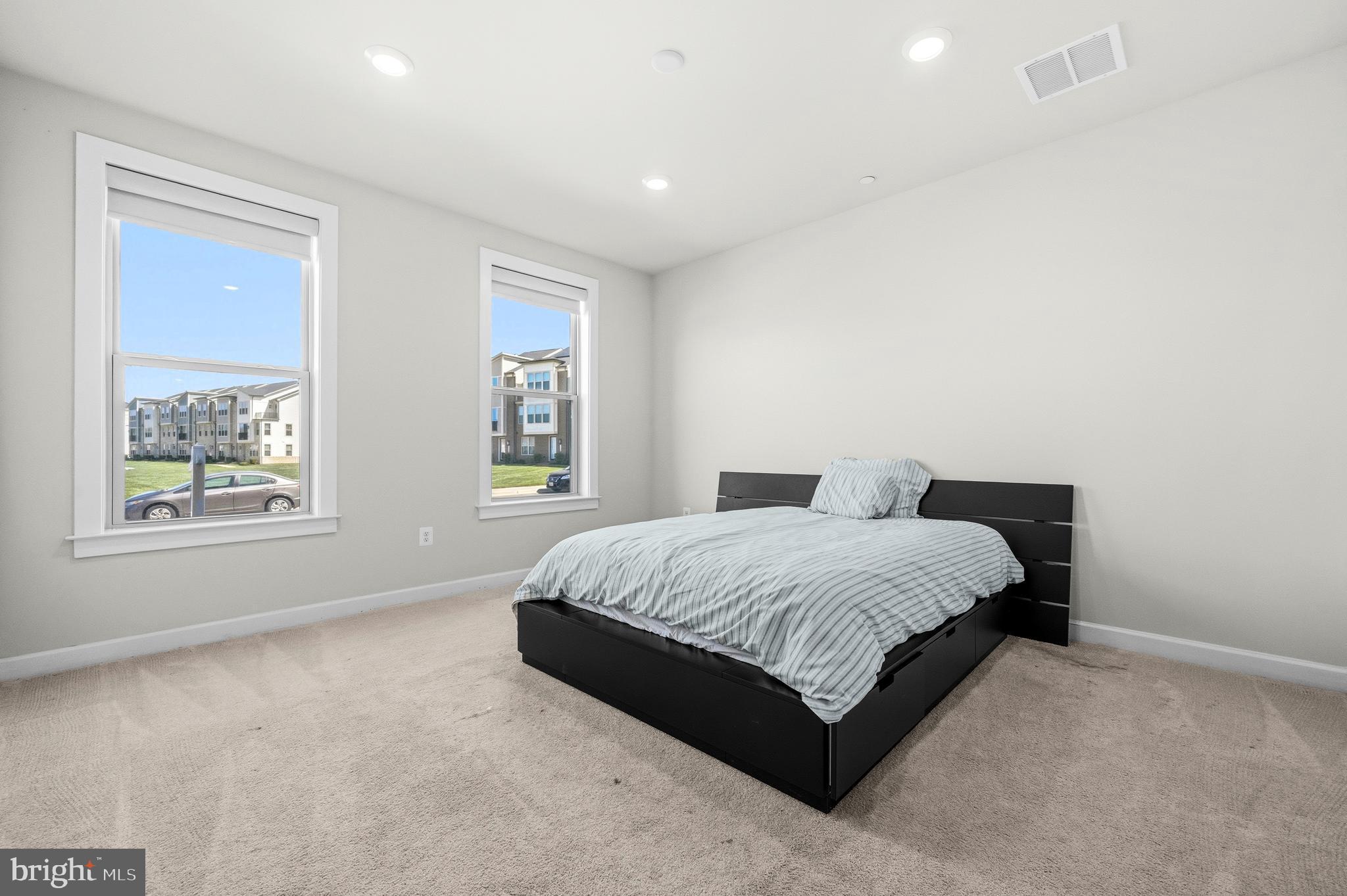 103 Brown Branch Road Laurel, MD 20708 - Photo 23 of 35 a spacious bedroom with a bed and window